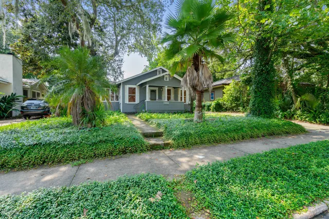 a kitchen with granite countertop a stove and a sink
