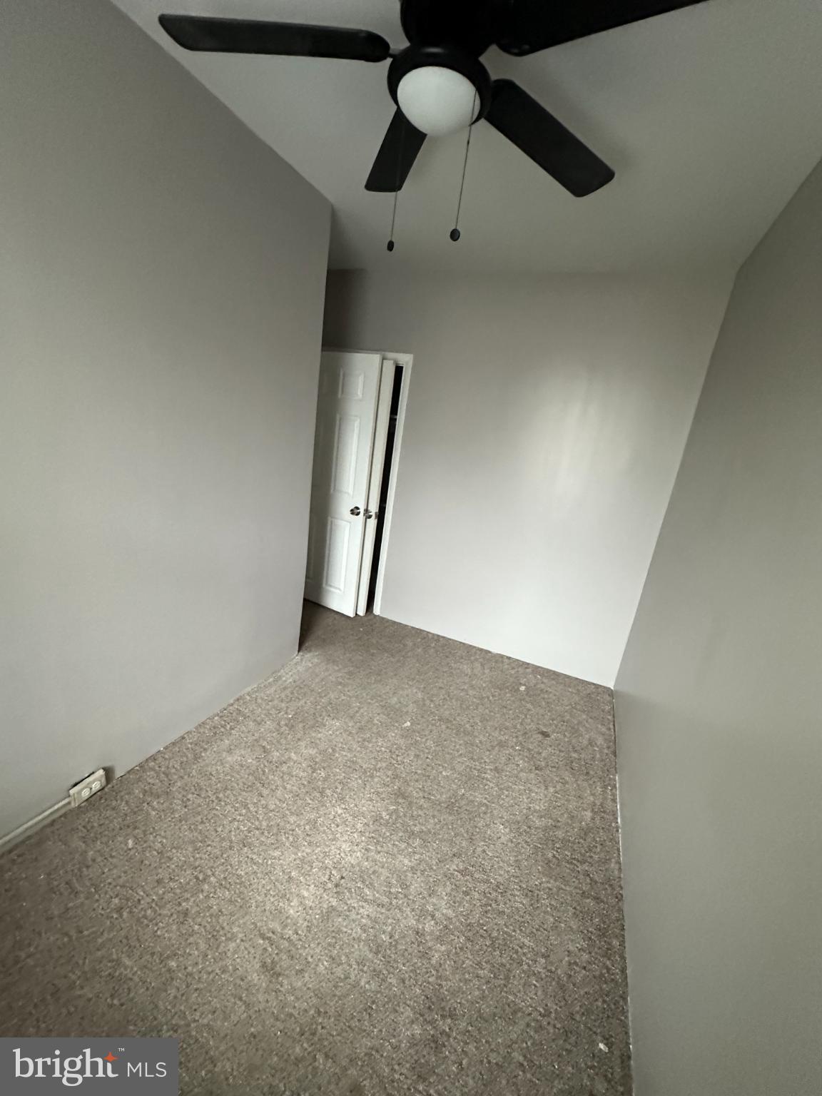 5913 Locust Street Philadelphia, PA 19139 - Photo 8 of 11 an empty room with staircase and fan