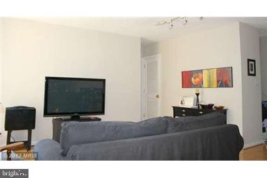 1800 R Street Northwest, Unit 604 Washington, DC 20009 - Photo 4 of 17 Modern living space with vibrant art.