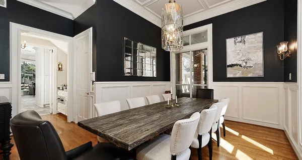 a kitchen with granite countertop a stove a sink and a refrigerator