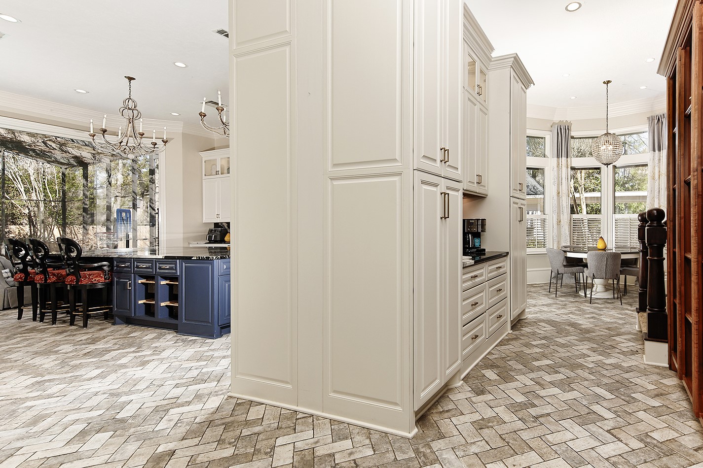 38 Grogans Point Road The Woodlands, TX 77380 - Photo 13 of 50 a view of a kitchen with refrigerator and windows