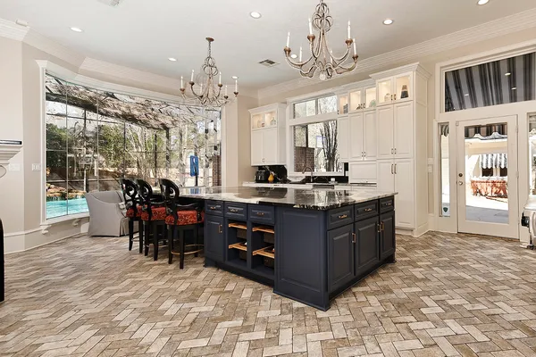 a view of a dining room with furniture a chandelier and wooden floor