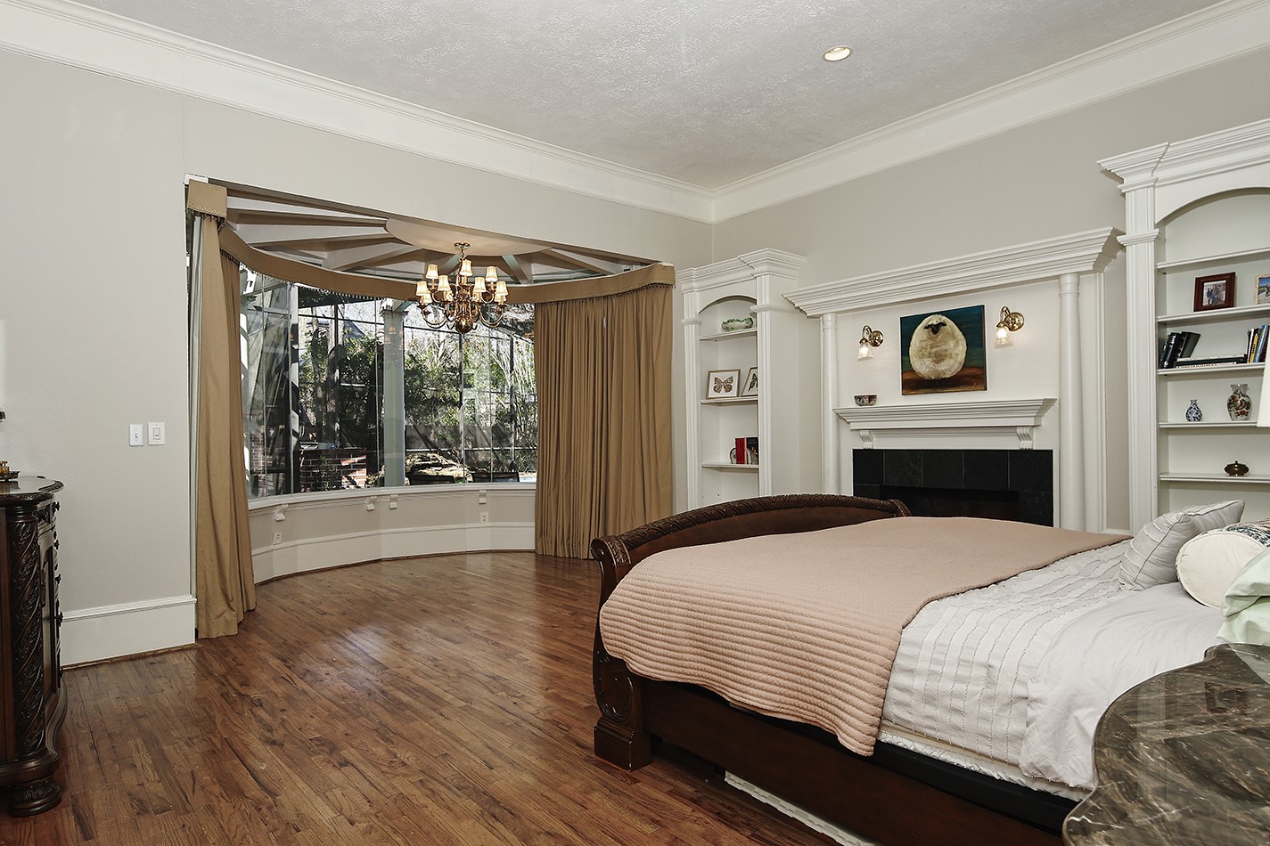 38 Grogans Point Road The Woodlands, TX 77380 - Photo 21 of 50 a bedroom with a large bed and a large window