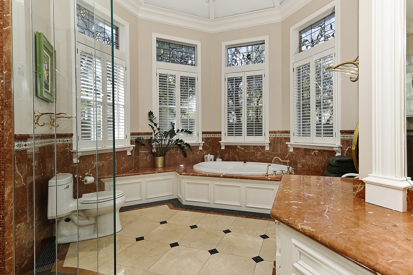 38 Grogans Point Road The Woodlands, TX 77380 - Photo 24 of 50 Primary spa bath offers gorgeous counters and walk-in closets. Her side of the bathroom offers an air tub and makeup vanity.