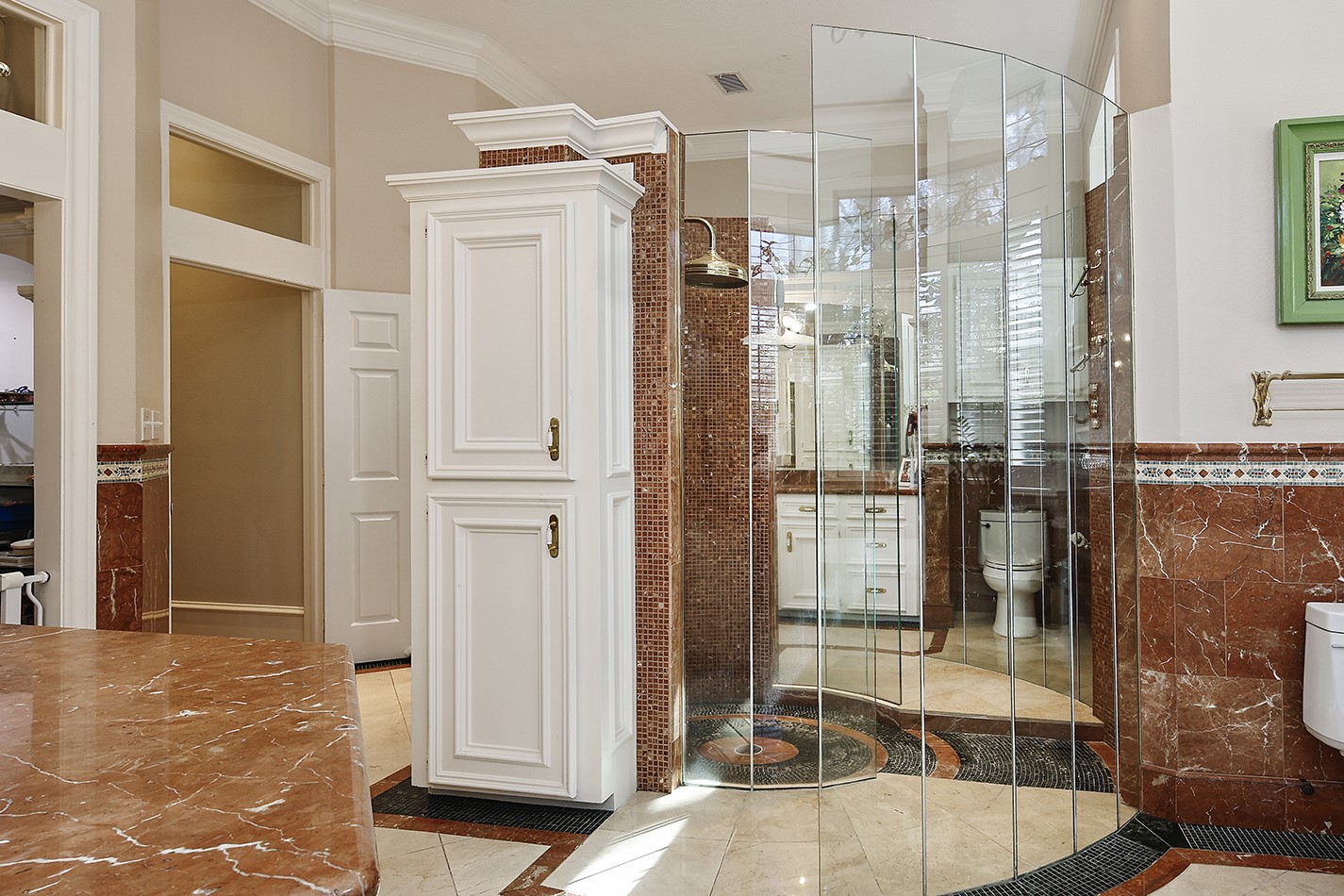 38 Grogans Point Road The Woodlands, TX 77380 - Photo 25 of 50 a bathroom with a glass shower door
