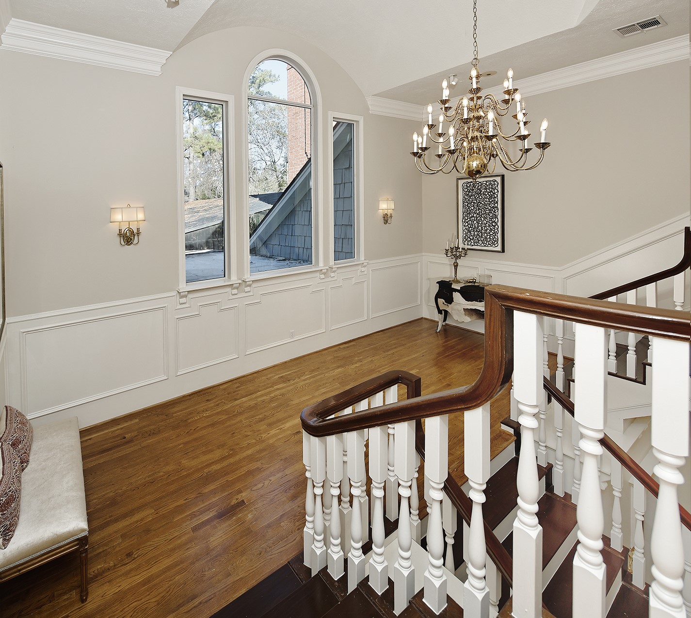 38 Grogans Point Road The Woodlands, TX 77380 - Photo 27 of 50 a view of a dining room with furniture a chandelier and wooden floor