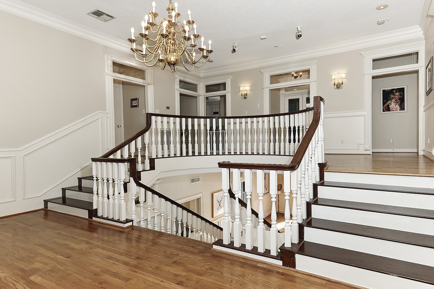 38 Grogans Point Road The Woodlands, TX 77380 - Photo 28 of 50 a view of entryway with wooden floor and stairs