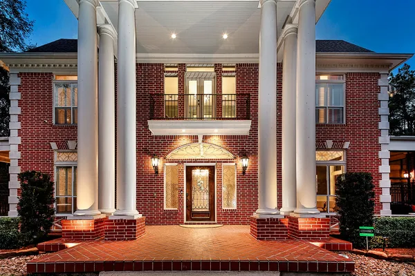 a living room with furniture fireplace and flat screen tv