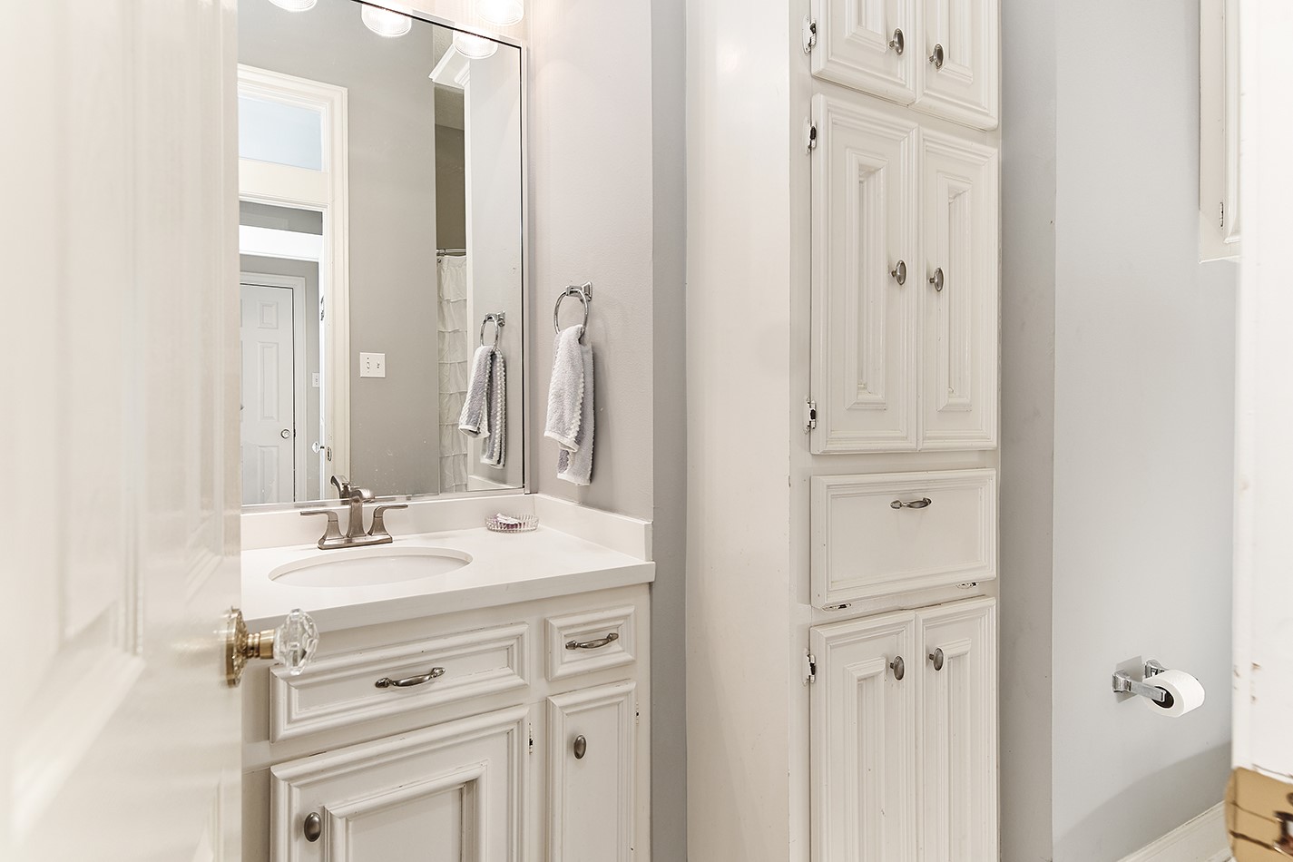 38 Grogans Point Road The Woodlands, TX 77380 - Photo 35 of 50 a bathroom with a sink and a mirror