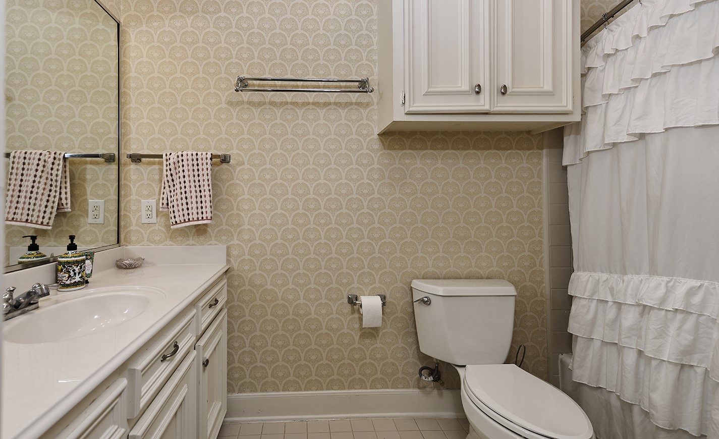 38 Grogans Point Road The Woodlands, TX 77380 - Photo 38 of 50 a bathroom with a sink a toilet and shower