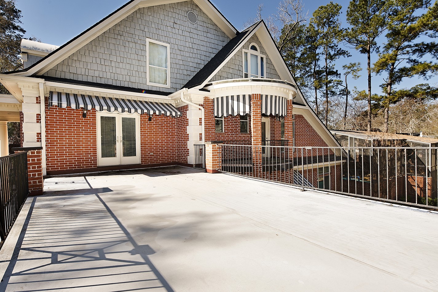 38 Grogans Point Road The Woodlands, TX 77380 - Photo 40 of 50 a view of a house with wooden floor