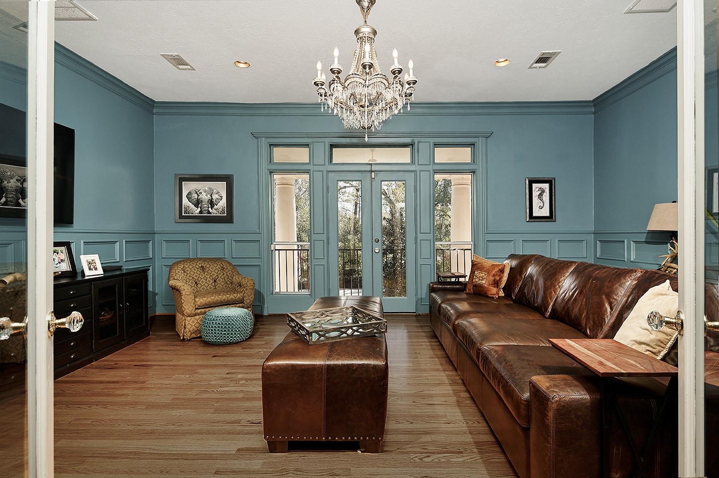 38 Grogans Point Road The Woodlands, TX 77380 - Photo 41 of 50 a living room with furniture a chandelier and a large window