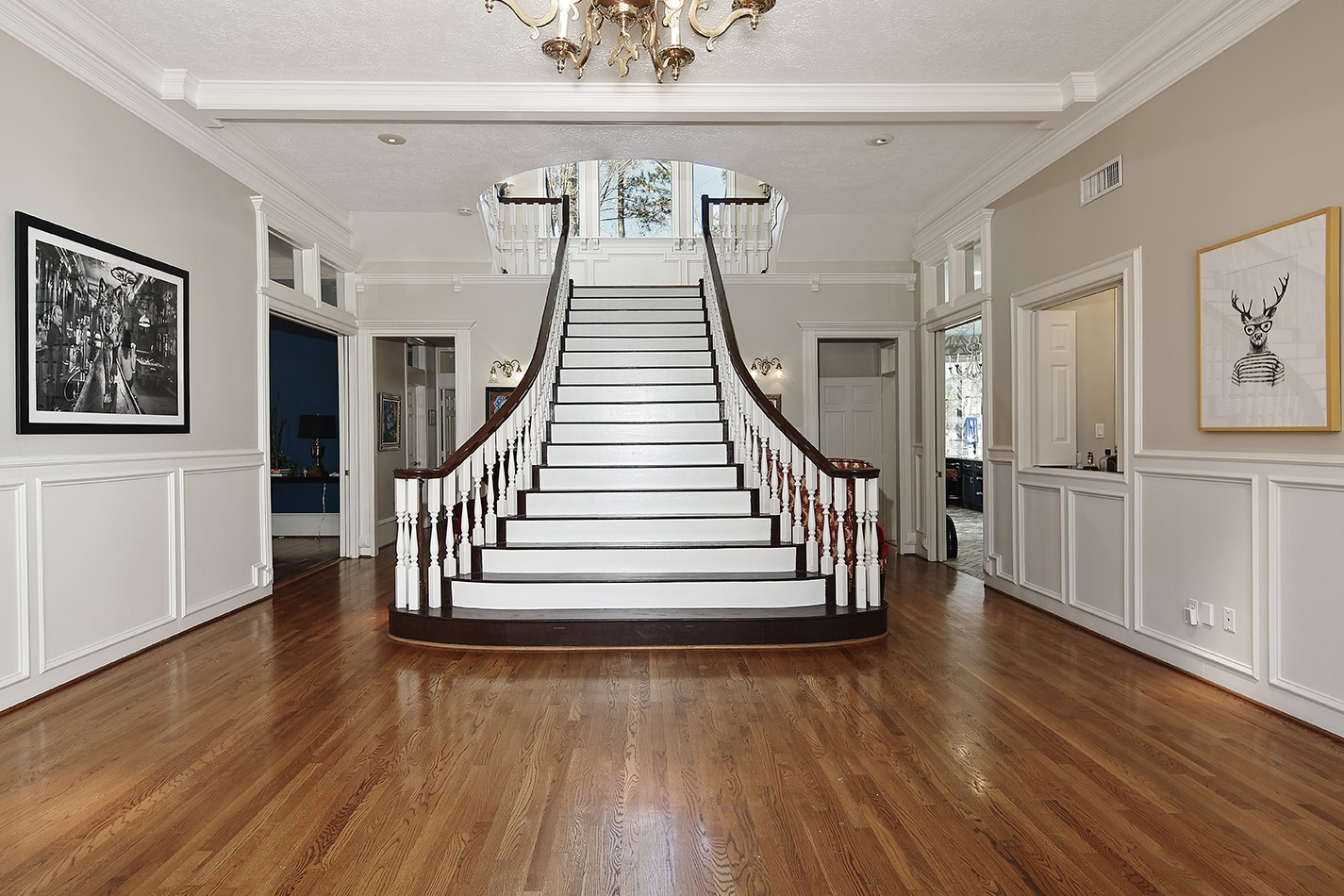 38 Grogans Point Road The Woodlands, TX 77380 - Photo 5 of 49 The grand 2-story foyer with bygone-era stairway greets you immediately upon entrance