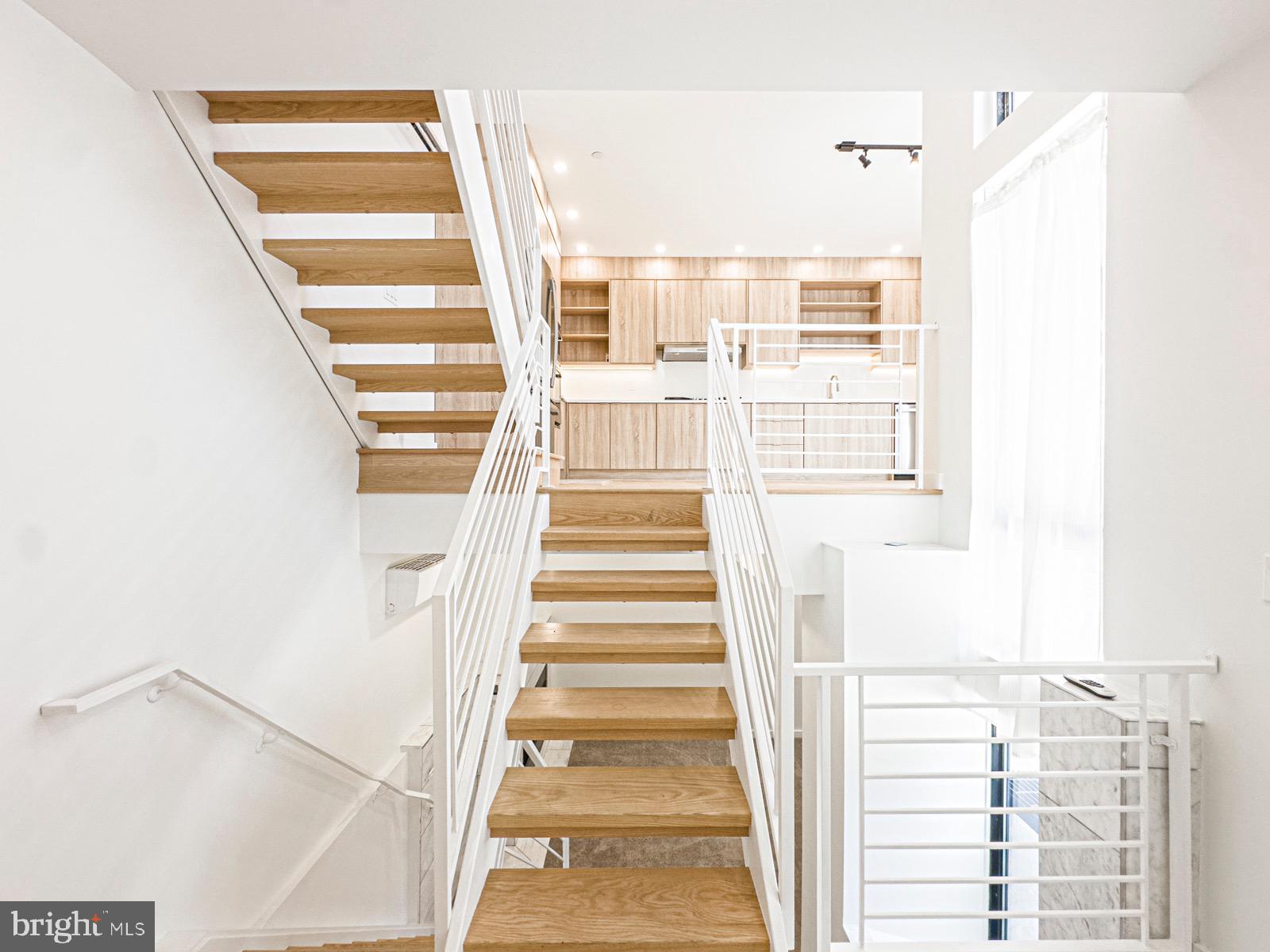 1606 North 4th Street Philadelphia, PA 19122 - Photo 22 of 82 Modern staircase leading to bright living space.