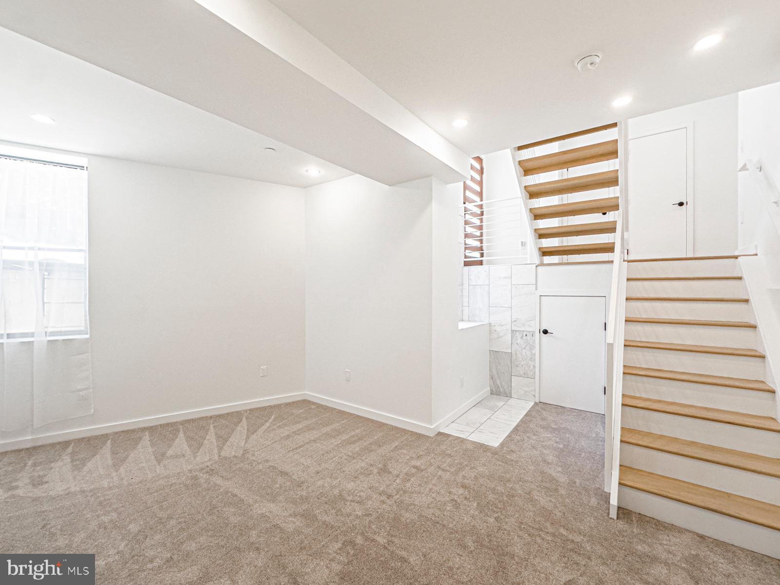 1606 North 4th Street Philadelphia, PA 19122 - Photo 27 of 82 Bright and airy basement with modern stairs.