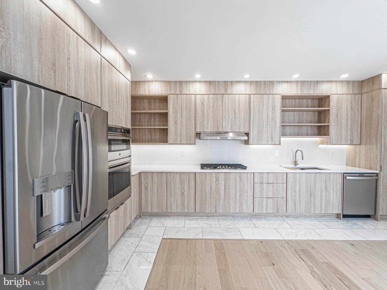 1606 North 4th Street Philadelphia, PA 19122 - Photo 31 of 82 Sleek modern kitchen with warm wood accents.