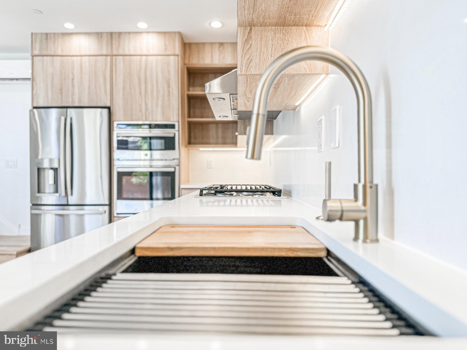 1606 North 4th Street Philadelphia, PA 19122 - Photo 37 of 82 Sleek modern kitchen with elegant finishes.