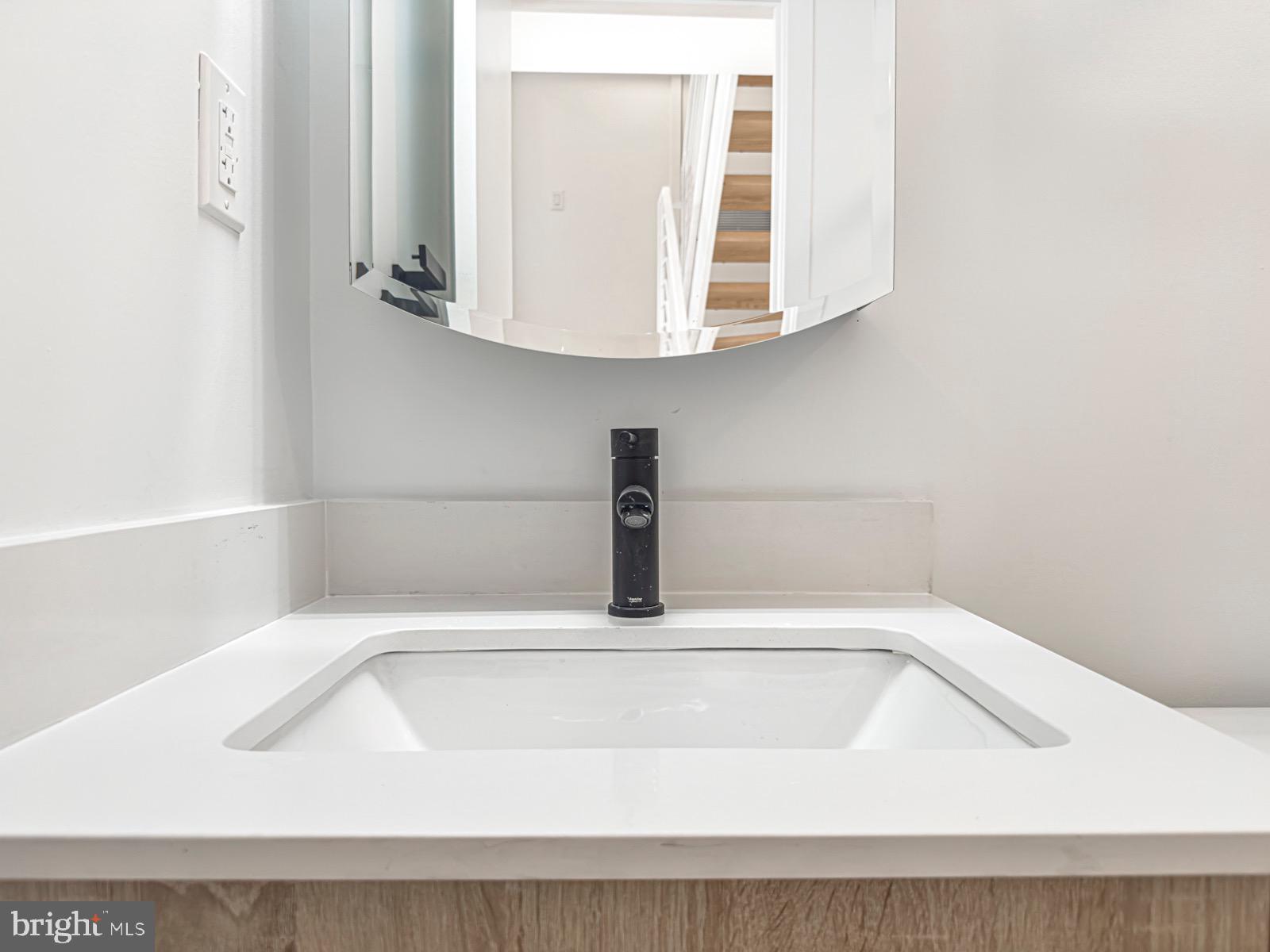 1606 North 4th Street Philadelphia, PA 19122 - Photo 49 of 82 Sleek modern sink with elegant mirror.