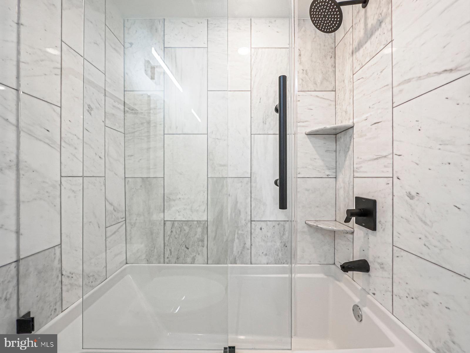 1606 North 4th Street Philadelphia, PA 19122 - Photo 50 of 82 Sleek marble shower with modern fixtures.