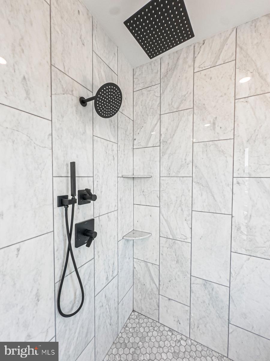 1606 North 4th Street Philadelphia, PA 19122 - Photo 67 of 82 Sleek marble shower with modern fixtures.