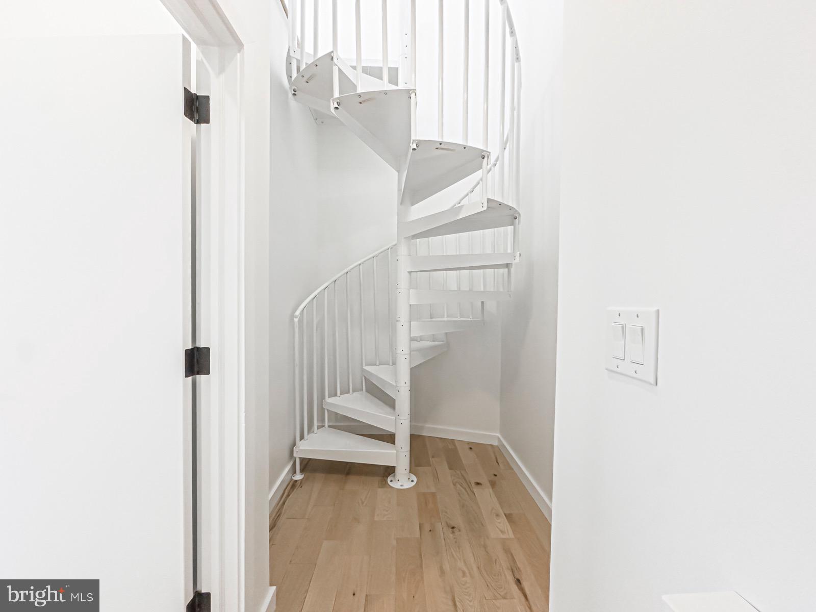 1606 North 4th Street Philadelphia, PA 19122 - Photo 73 of 82 Elegant spiral staircase in bright hallway.