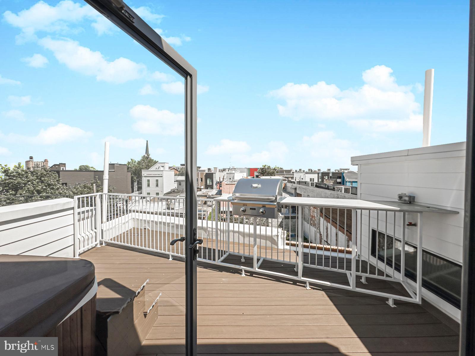 1606 North 4th Street Philadelphia, PA 19122 - Photo 80 of 82 Sunny rooftop retreat with city views.