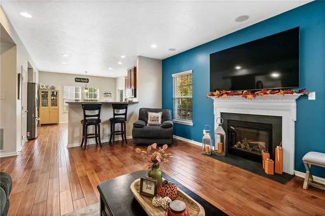 a living room with furniture fireplace and flat screen tv