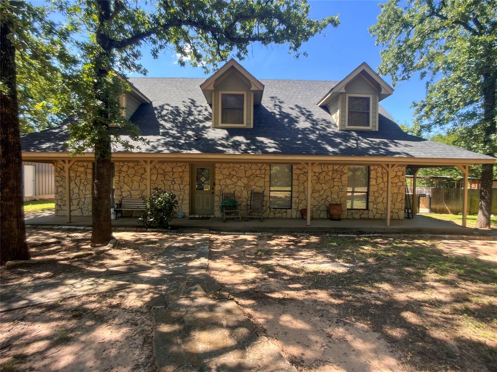 107 Private Road Whitney, TX 76692 - Photo 21 of 29 a view of a house with a yard