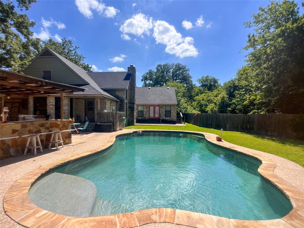 107 Private Road Whitney, TX 76692 - Photo 23 of 29 a swimming pool with outdoor seating and yard