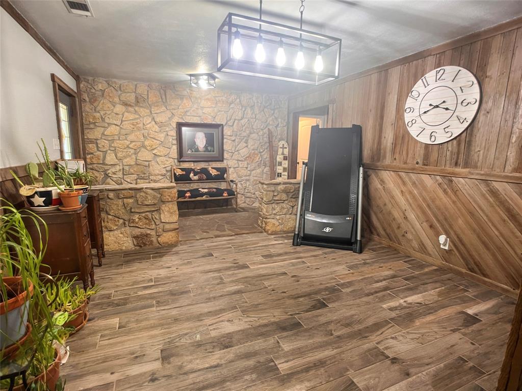107 Private Road Whitney, TX 76692 - Photo 4 of 29 a living room with furniture and a flat screen tv