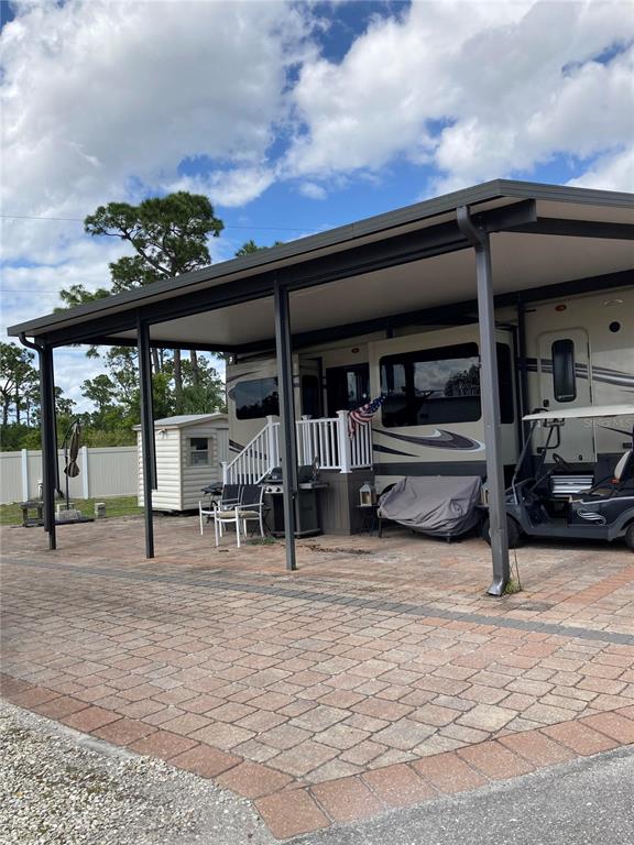 a view of a car park in front of house