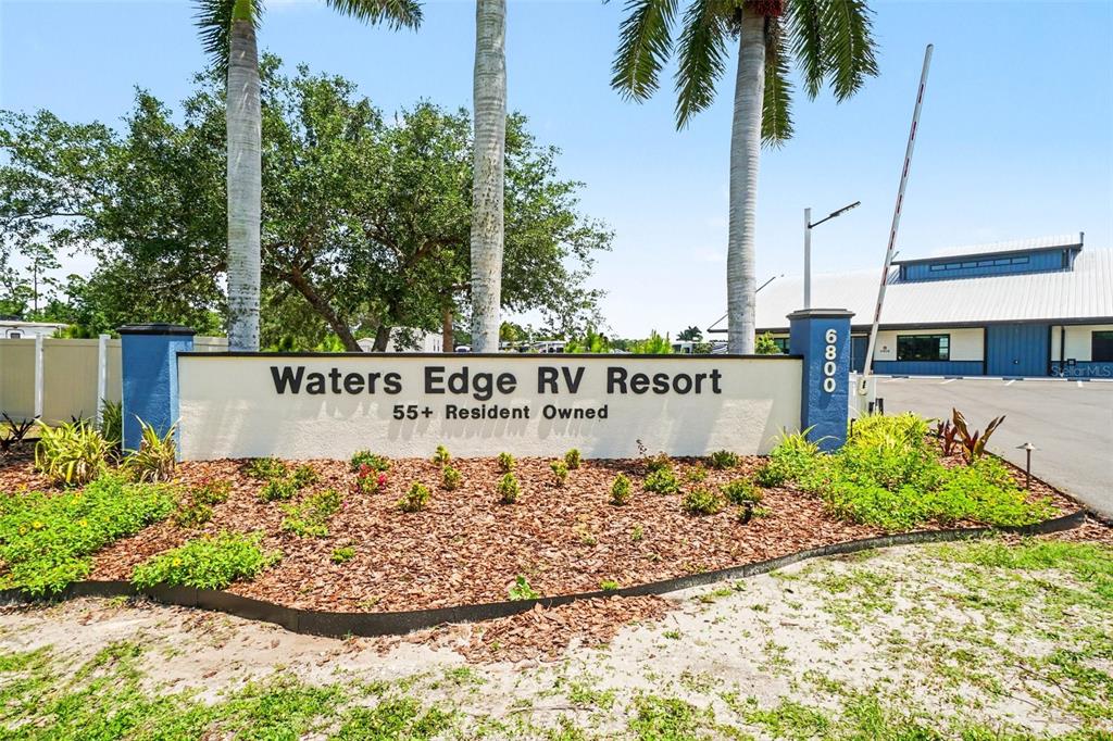 6800 Golf Course Boulevard, Unit H6 Punta Gorda, FL 33982 - Photo 13 of 15 a sign on the side of a building