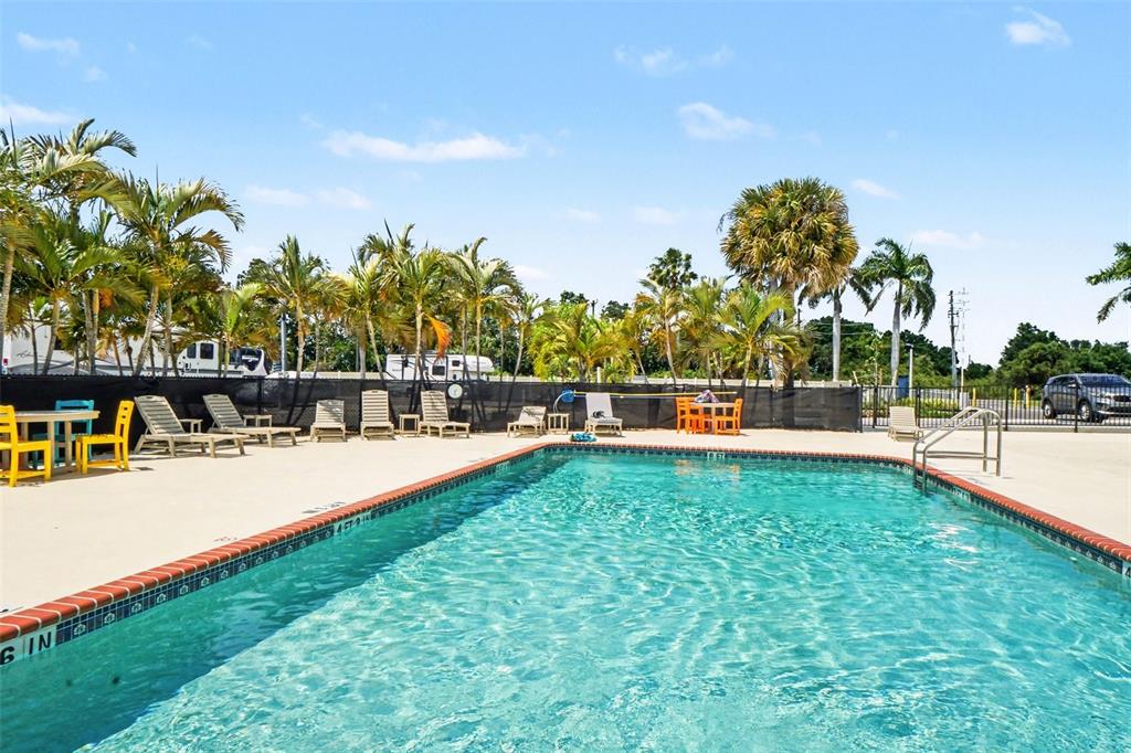 6800 Golf Course Boulevard, Unit H6 Punta Gorda, FL 33982 - Photo 14 of 15 a view of a swimming pool with an outdoor seating
