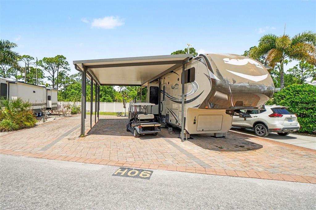 6800 Golf Course Boulevard, Unit H6 Punta Gorda, FL 33982 - Photo 3 of 15 a car parked in front of a building