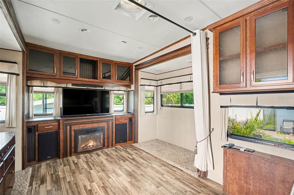 6800 Golf Course Boulevard, Unit H6 Punta Gorda, FL 33982 - Photo 4 of 15 a bedroom with a bed and a flat screen tv