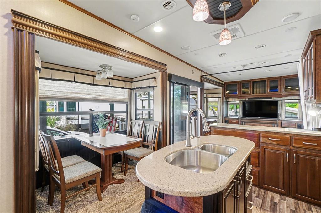 6800 Golf Course Boulevard, Unit H6 Punta Gorda, FL 33982 - Photo 6 of 15 a outdoor space with furniture and a flat screen tv