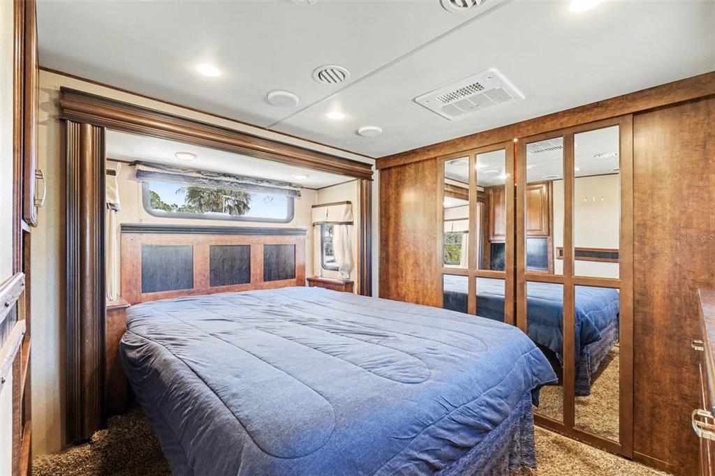 6800 Golf Course Boulevard, Unit H6 Punta Gorda, FL 33982 - Photo 10 of 15 a bedroom with a large bed and a large window