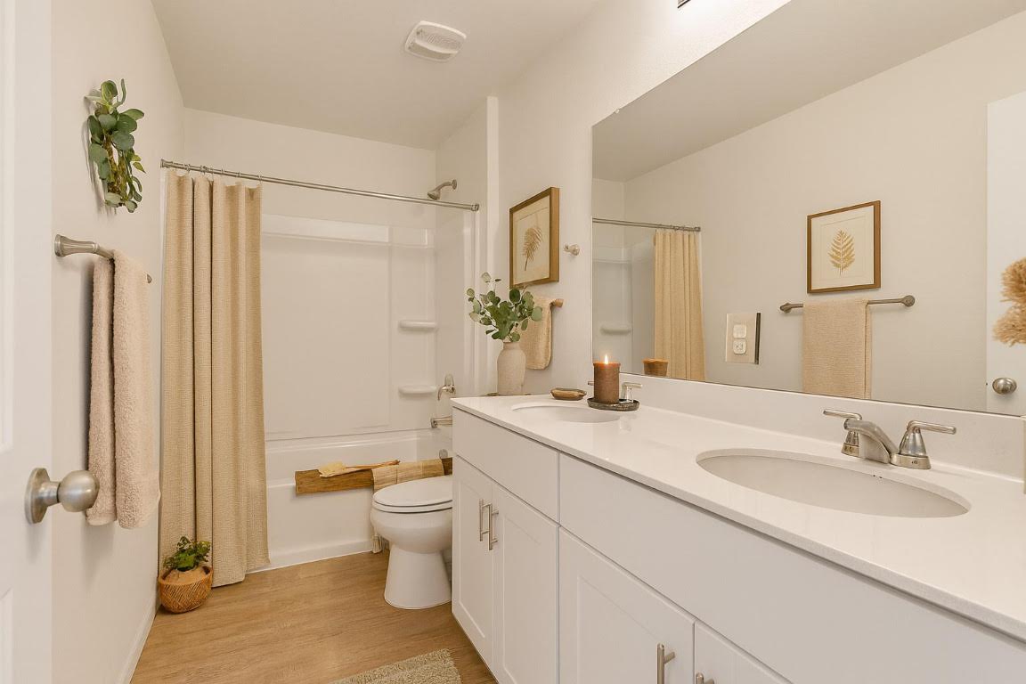 905 Duskywing Way Georgetown, TX 78626 - Photo 11 of 21 a bathroom with a sink a toilet and shower