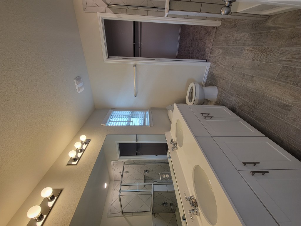 905 Duskywing Way Georgetown, TX 78626 - Photo 20 of 21 a spacious bathroom with a double vanity sink toilet and shower