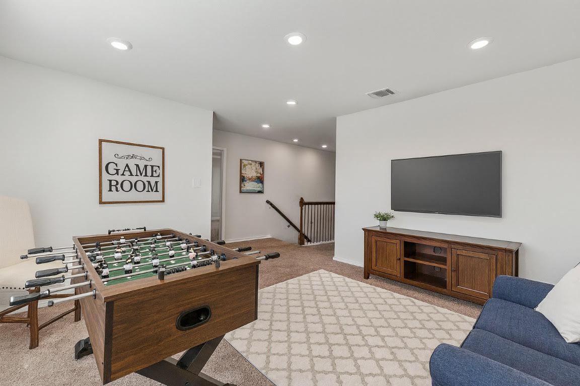 905 Duskywing Way Georgetown, TX 78626 - Photo 9 of 21 a living room with furniture and a flat screen tv