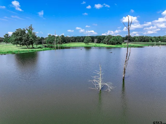 a view of a lake in middle of a house with a lake view