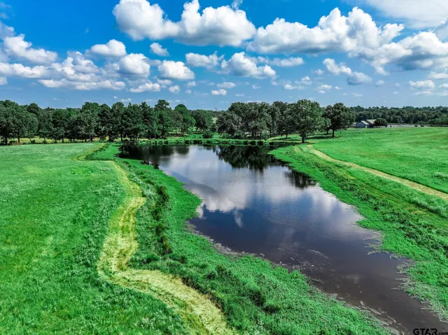 a view of a lake with a yard