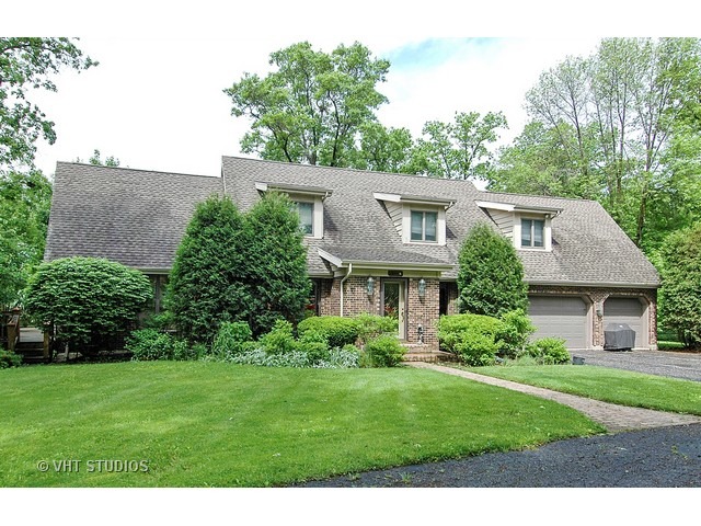 a view of a garden with a house