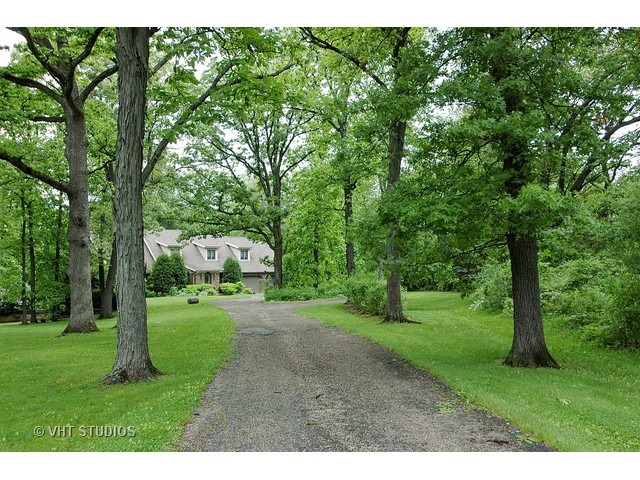 14511 Marengo Road Union, IL 60180 - Photo 2 of 25 a grassy field with trees in the background