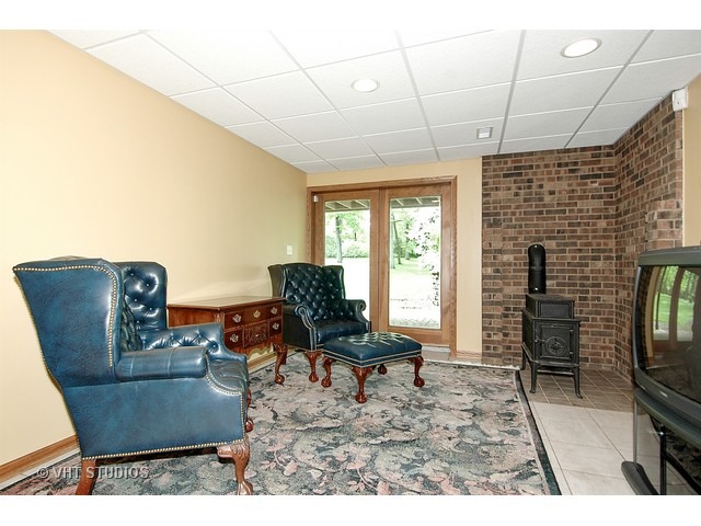 14511 Marengo Road Union, IL 60180 - Photo 12 of 25 a living room with furniture and a flat screen tv