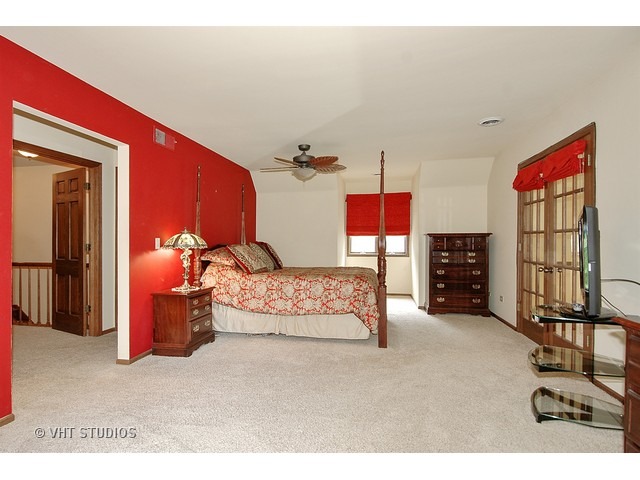 14511 Marengo Road Union, IL 60180 - Photo 14 of 25 a bedroom with furniture and a flat screen tv