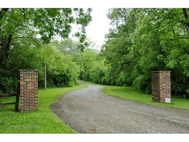 14511 Marengo Road Union, IL 60180 - Photo 3 of 25 a view of a backyard with large trees