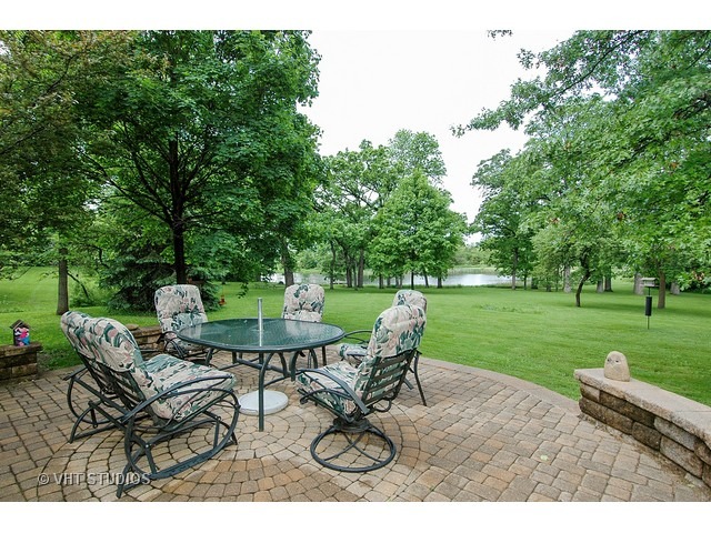 14511 Marengo Road Union, IL 60180 - Photo 21 of 25 a view of a table and chairs in the garden