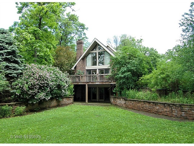 14511 Marengo Road Union, IL 60180 - Photo 22 of 25 a front view of a house with a yard and trees