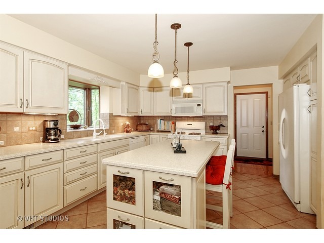14511 Marengo Road Union, IL 60180 - Photo 5 of 25 a kitchen with cabinets and window